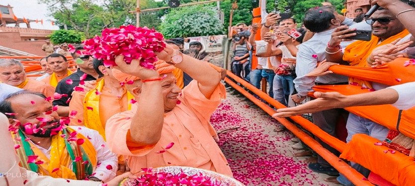 CM-Yogi-is-showering-flower-petals-on-the-people